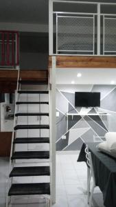 a staircase in a room with a wall at Bless1 in Puerto Madryn