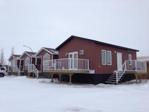 a row of houses in the snow in front at Chaparral Inn in Arcola