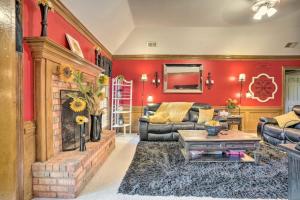 a living room with red walls and a fireplace at Comfortable and Pleasant 4 Bedroom Home in Memphis