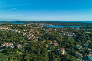 an aerial view of a small town in the middle of a lake at Apartments Davor in Banjole
