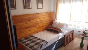 Cama ou camas em um quarto em Pousada Caminhos de Minas Belo Horizonte