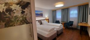 Postel nebo postele na pokoji v ubytování Hotel Garni Belvedere