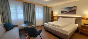 Postel nebo postele na pokoji v ubytování Hotel Garni Belvedere