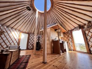 an interior view of a yurt with a round window at Jurta I Sauna z widokiem na Tatry in Knurów