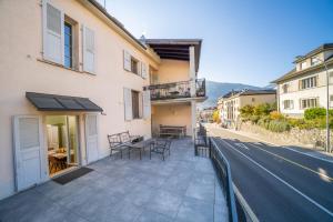 a balcony of a building next to a street at Luxury 3 bedroom apartment - old town of Sion in Sion