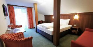 Postel nebo postele na pokoji v ubytování Hotel Garni Belvedere