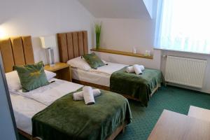 Ένα ή περισσότερα κρεβάτια σε δωμάτιο στο Hotel Duet +65 φωτογραφίες