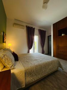 Postel nebo postele na pokoji v ubytování Villa Domenico