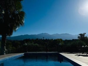 a swimming pool with a view of the mountains at Villa Domenico in Vryses