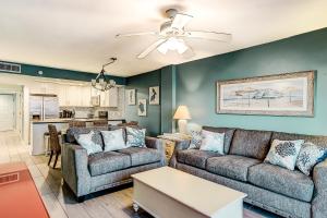 a living room with two couches and a ceiling fan at x Sea Marsh II 503 in Myrtle Beach