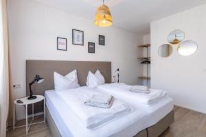 Łóżko lub łóżka w pokoju w obiekcie Appartements DAS RETTENBACHER