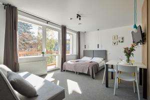 Łóżko lub łóżka w pokoju w obiekcie Villa Alpina - 5 minut do szlaków i wyciągów