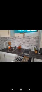 a kitchen with a sink and a counter top at Dunes to explore and relax right by the desert wifi in Corralejo