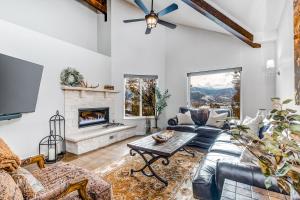 a living room with a couch and a fireplace at Sackett Escape in Park City