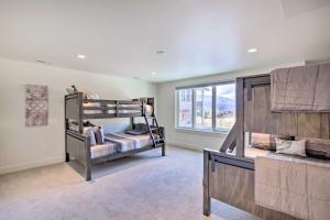 a bedroom with two bunk beds and a window at Scenic Eden Gem with Hot Tub about 6 Mi to Ski Area in Eden