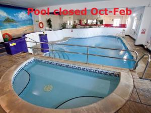 a jacuzzi tub in a building with the words pool closed off fed at Saddle Cottage in Penzance