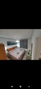 a bedroom with a large bed in a room at Dunes to explore and relax right by the desert wifi in Corralejo
