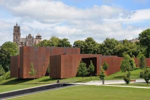 a building in the middle of a park at Le Planard in Rodez