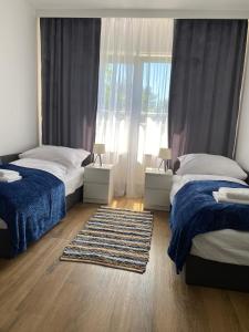 Posteľ alebo postele v izbe v ubytovaní Apartamenty nad zalewem 222