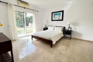 A bed or beds in a room at Villa Scenic with Private Pool - Sleeps 8