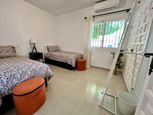 A bed or beds in a room at Villa Scenic with Private Pool - Sleeps 8