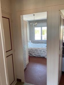 Rúm í herbergi á ST JEAN DE MONTS - VUE MER - 2 Chambres