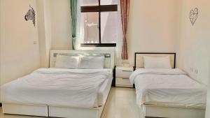Postel nebo postele na pokoji v ubytování Sanli B&B