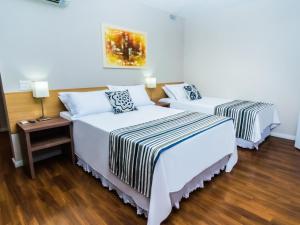 Cama o camas de una habitación en Hotel Nacional Inn Porto Alegre - Próximo ao Complexo Hospitalar Santa Casa e UFRGS