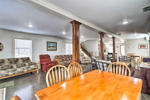 a living room with a wooden table and chairs at Remote Retreat Cozy Home with Big Pine Lake Access! in Perham