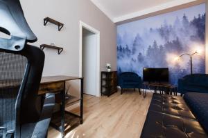 a living room with a desk and a tv at Joy City Stay Piatra Craiului 8 in Timişoara