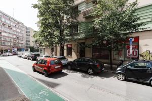 a group of cars parked on a city street at Joy City Stay Piatra Craiului 8 in Timişoara
