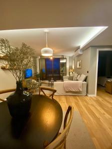 a living room with a couch and a table at Rooftop Marina l by Madeira Best Apartments in Funchal