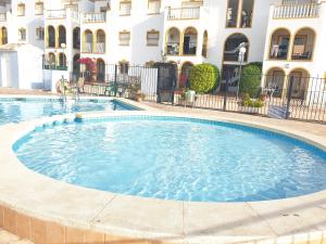 Bazén v ubytování Sunlight Apartment - Molino Blanco - La Zenia nebo v jeho okolí