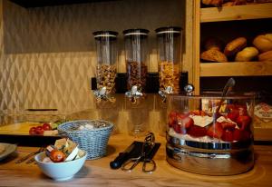 a counter top with a bunch of food on it at Gasthaus Paula in Üdersdorf