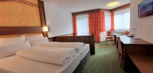 Postel nebo postele na pokoji v ubytování Hotel Garni Belvedere