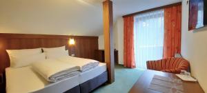 Postel nebo postele na pokoji v ubytování Hotel Garni Belvedere