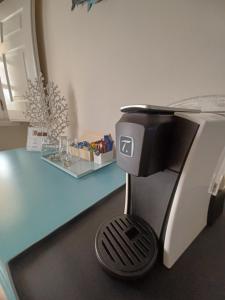 a coffee machine sitting on top of a counter at Villa Zawaia B&B in Lagos