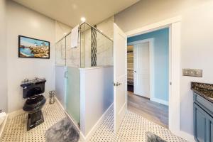 a bathroom with a walk in shower and a toilet at Ocean Escape in Ogunquit +27 photos