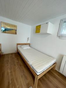 Giường trong phòng chung tại Logement entier - Quartier Phare - Tranche sur Mer