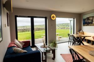 a living room with a couch and a table at Aiteall Bed and Breakfast in Liscannor