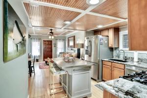 a kitchen with a refrigerator and a counter top at Palmettos Cabana in Saint Augustine