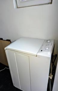a white washer and dryer in a room at Back Garden Cabin Home with Terrace(Self Check-in) 