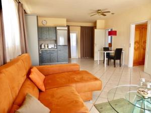 a living room with a couch and a table at Dein Appartement Sunset View und Meer in La Pared