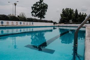 a large swimming pool with blue water at Amazing House in Aguacalientes with Pool in Aguascalientes