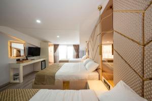 Cama ou camas em um quarto em Luxury Airport Hotel By Zazzoni-İstanbul Airport