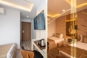 Uma TV ou centro de entretenimento em Luxury Airport Hotel By Zazzoni-İstanbul Airport