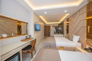 Cama ou camas em um quarto em Luxury Airport Hotel By Zazzoni-İstanbul Airport