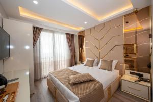 Cama ou camas em um quarto em Luxury Airport Hotel By Zazzoni-İstanbul Airport