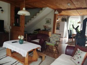 a living room with a couch and a table at Holiday Home Slavica in Kupres