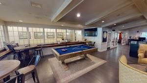 a large room with a pool table in it at Avon Old Farms Hotel in Avon